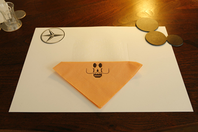Taste Buds 2008
The embossed invitation to the Total Trattoria doubles up as placemat. At the Trattoria, placemats have been the calling card of a making process beyond the preparation of the food and were often used as the transaction ticket when the Trattoria took place in a location without a food licence. The placemat artwork was purchased and the food was served after the formal transaction although the artwork was only considered complete once it had acquired the evidence of its use.
Letterpress paper