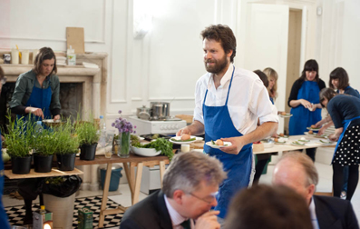 Martino serving asparagus and saffron boiled egg